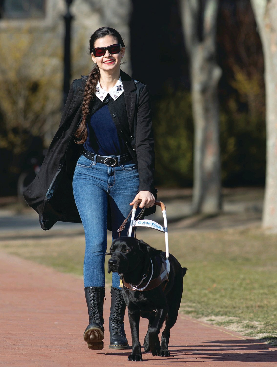 A SCHOLAR TOO: Johnston resident and URI graduate Aria Mia Loberti, pictured here with her guide dog Ingrid, traveled to London on a Fulbright grant, and is working on her doctorate at Penn State.